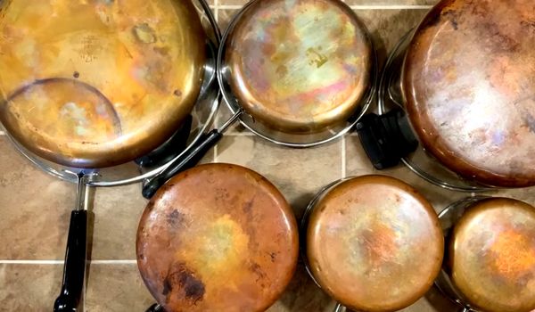 Try salt for cast iron and copper to clean pots and pan